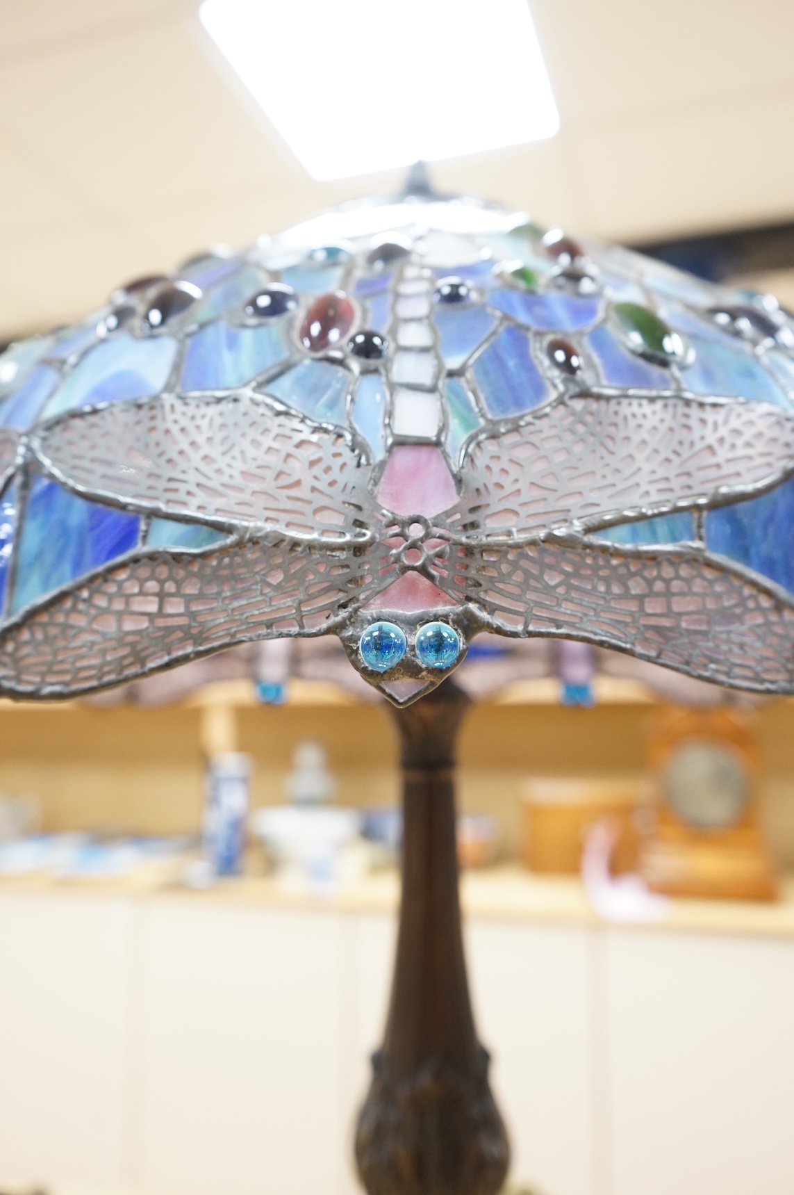 Two Tiffany style table lamps, with ornate glass and metal shades, tallest 72cm high